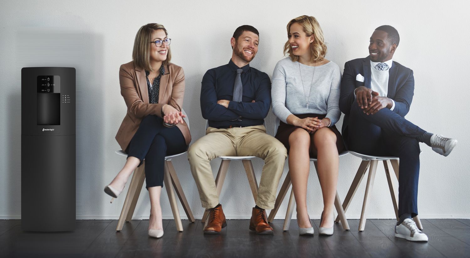 Office team seated next to a Waterlogic WL3 water dispenser